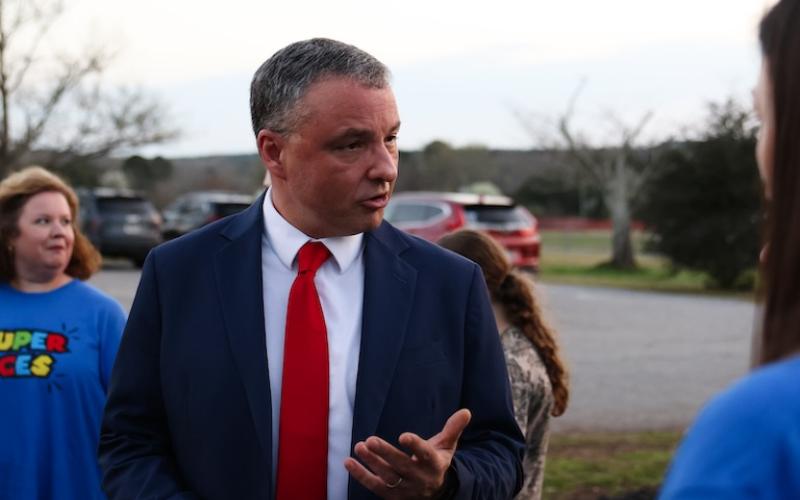 Phillip Powell talks to parents and teachers outside the Oglethorpe County School District on March 10, 2026, in Lexington. (Photo/Sydney Shankman)