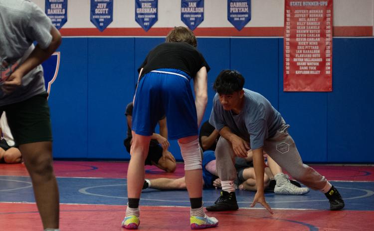 Brian Valladares, senior, practices in the wrestling room at Oglethorpe County High School on Nov. 8. Valladares wrestled on the Oglethorpe state team last year. (Photo/Sarah White)
