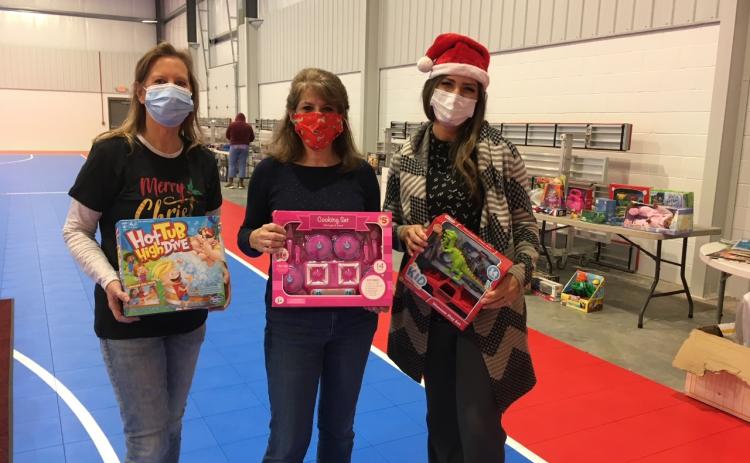Volunteers for the Community Christmas charitable group post for a photo at an event in 2020. (Submitted Photo)