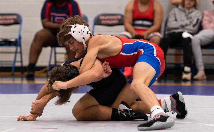 Freshman Miles Mason wrestles AJ Harris of Putnam County in Oglethorpe County's home opener. The Patriots defeated Putnam County 72-18. (Photo/Sarah White)