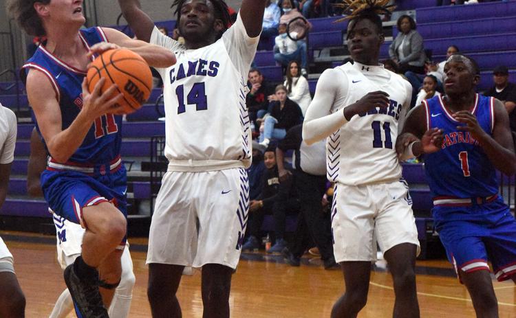 Luke McGarity drives to the basket in a 39-36 loss to Jasper County. (Photo/Sarah White)