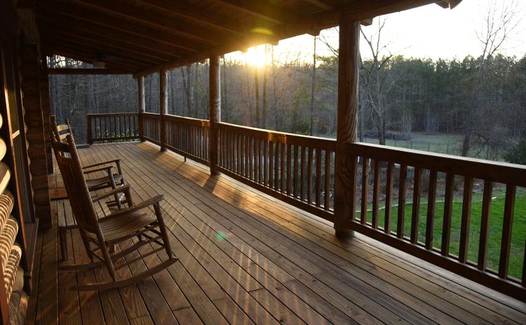 Wingate Downs converted his photography studio into a cabin called Oak Ridge Lodge. It and the surrounding 20 acres have become a popular destination for wedding and fans of Georgia football opponents. (Submitted Photo)