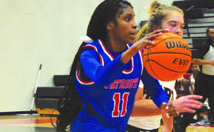 Oglethorpe County's Ariana Bell drives to the basked in the Lady Patriots' 67-60 overtime loss Tuesday to Hart County. (Submitted Photo/Ralph Maxwell)