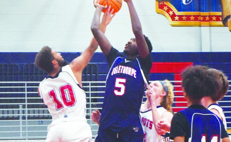 Nick Huff (5) shoots over Henry Johnson (20) during the Oglethorpe County basketball team's Super Saturday fundraiser on Nov. 13. The Varsity Blue team played the Varsity White team in a scrimmage, and other activities included 3-point, hot-shot and dunk competitions. (Photo/Ralph Maxwell Jr.)