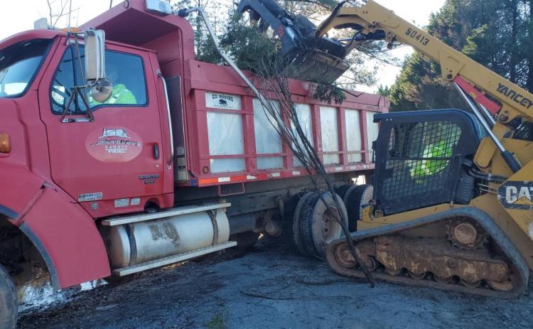 Crews from Oglethorpe County Public Works, including Tommy Wood in the dump truck and Logan Gabriel in the loader, clear debris from Brown’s Chapel Road. (Submitted Photo)