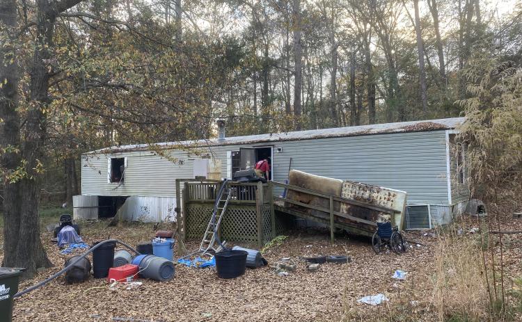 Authorities are investigating the cause of the fire at 115 Upson Court in Lexington on Sunday. A deputy pulled Jeffrey Shellnut and his dog from the fire. (Submitted Photo)