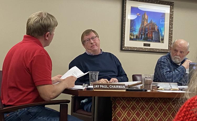 Chairman Jay Paul (from left) and commissioners Andy Saxon and  David Clark discuss the pros and cons of the new radio systems in a meeting this week. (Kate Hoffman/The Oglethorpe Echo)