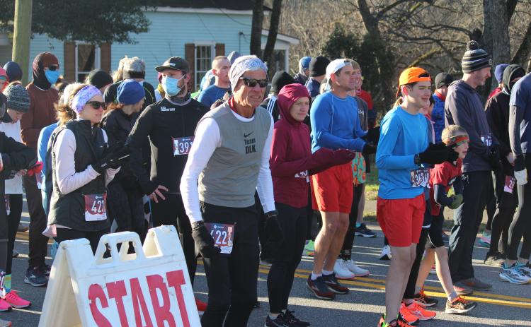 Runners line up at the start line at the Winterville Civitan Snowflake 10k on Jan. 29. There were 185 in-person participants in the race, which is the first race in the Firefly Trail Race Series. The other races are the Maxeys Model Mile 5k, Crawford Restoration Labor Day Run 5k and Union Point J3 5k, scheduled for later this year. (Mackenzie Tanner/The Oglethorpe Echo)
