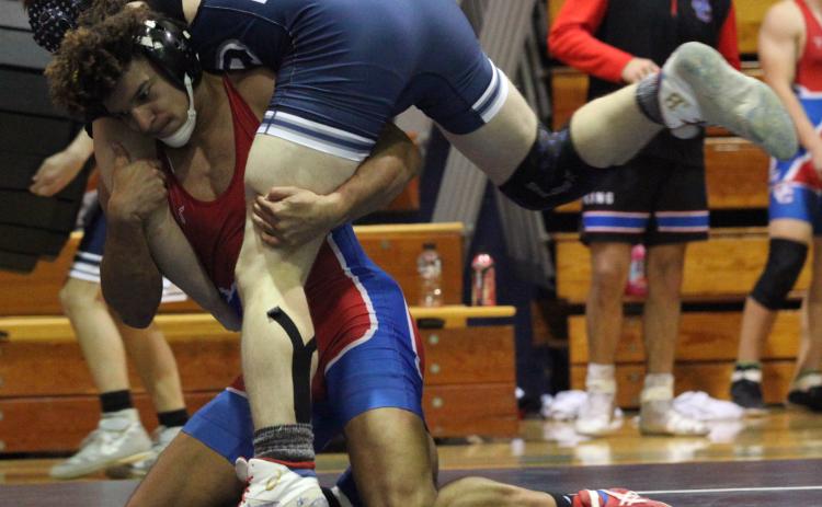 Nate Brown takes control of his match in the area tournament last weekend. Brown won the 160-pound championship and advanced to the state tournament. (Donny Faust/Submitted Photo)