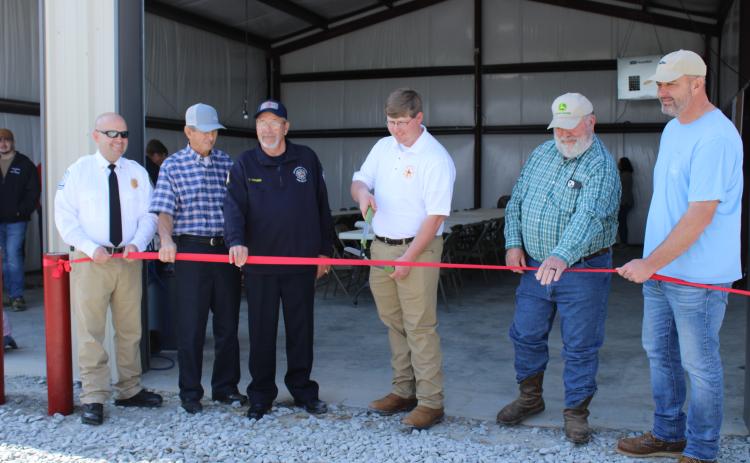 The Salem Fire Department celebrated the opening of its new station on March 5. Justin Sanders (from left), Lee Thaxton, Adam Nation, Carl Young, Phil Sanders and Ethan Thaxton line up for a photo before cutting the ribbon. (Eloise McNair/The Oglethorpe Echo)
