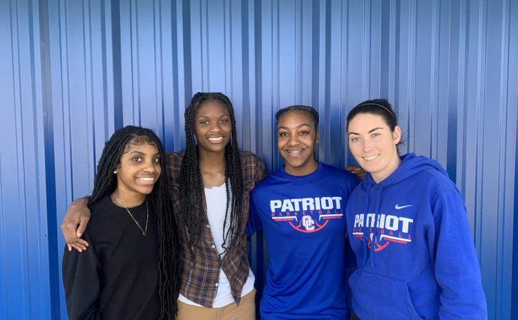 Denim Goddard (from left), Kenzie Henderson and McKenzie Freeman formed a strong core for coach Brianna Dickens (right) this season. (Kaylah House/ The Oglethorpe Echo)