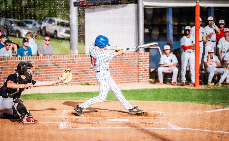 Russell Smith takes a cut in Oglethorpe County’s 7-4 victory over Putnam County on Friday. He’s hitting .390 and leads the Patriots in hits. (Carson Reynolds/The Oglethorpe Echo)