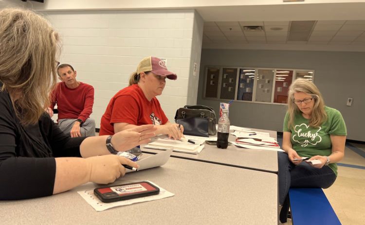 OCHS Athletic Booster Club president Jennifer Frost (right) and secretary Jill Kort (left) discuss additions to the OCHS concession stand at a recent club meeting. (Meredith Boyd/The Oglethorpe Echo)