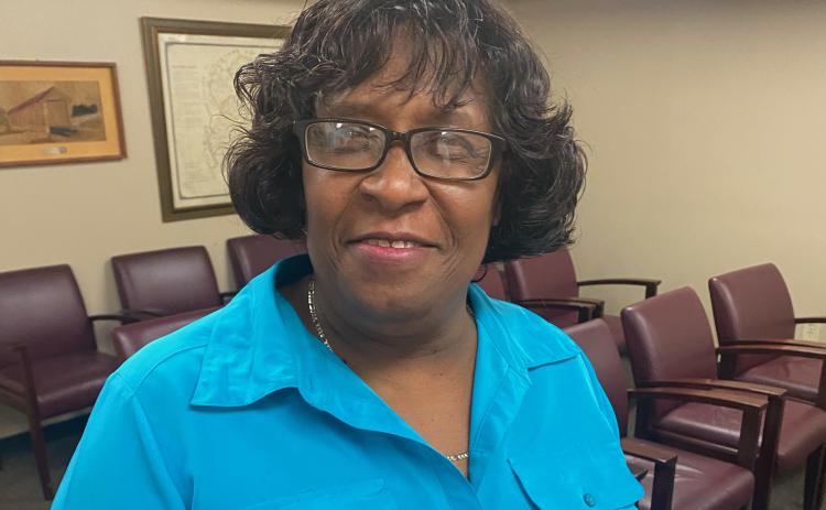 Hattie Collins has worked for the county for 14 years and is often the first person folks see when they come to the commission’s office. (Photo/Dink NeSmith)