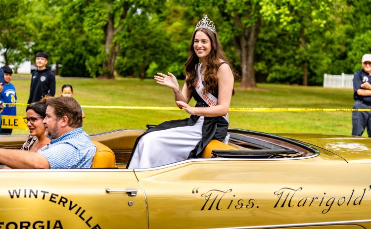 Miss Marigold — Roma Ellenberg, a 2021 Oglethorpe County High School graduate — rides in the Marigold Festival parade on Saturday. The festival, which is held in Winterville, resumed after a two-year hiatus. (Photo/Jack Casey)