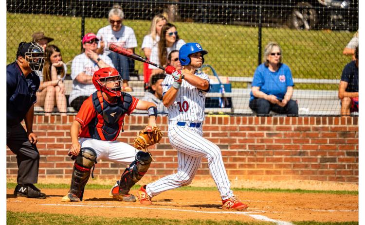 Oglethorpe County's Russel Smith follows the flight of the ball in the first game of the Class AA playoffs against Toombs County last week. (Photo/Jack Casey)
