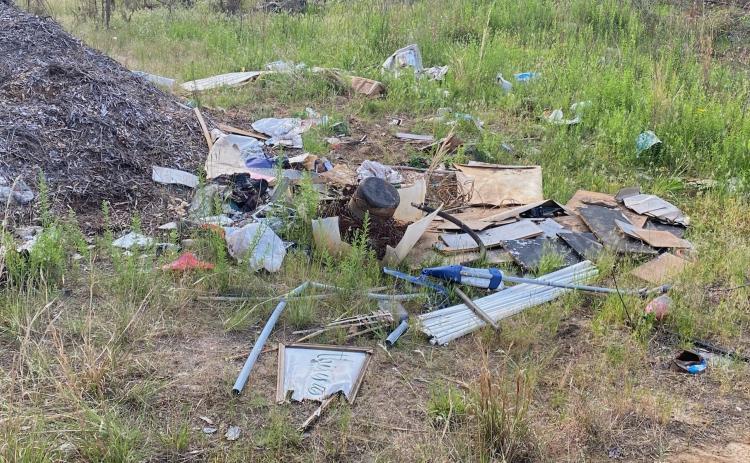 Trash and debris litter the area around Rocky Drive in the northeast part of the county. (Photo/Dink NeSmith)