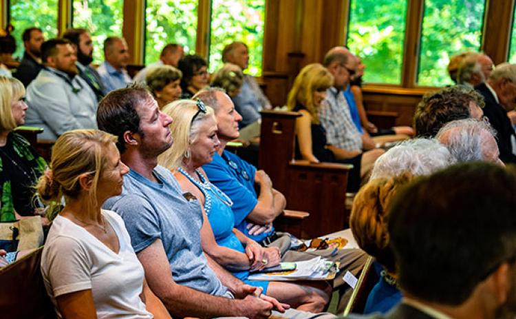 Guests fill the pews at the State Botanical Garden of Georgia’s Day Chapel during the memorial service for Rick Berry, who owned Goodness Grows and was the mayor of Lexington. (Photo/Jack Casey)