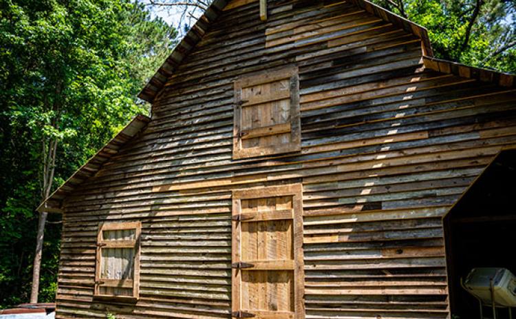 Donna Wetterlund has raised $6,500 of the estimated $20,000 it will take to finish restoring the barn on her daughter's property on Elberton Road. (Photo/Jack Casey)