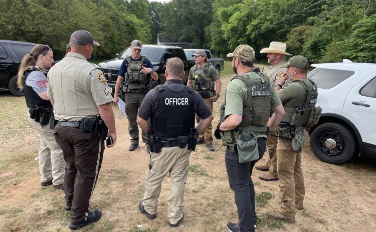 Law enforcement officers with various agencies, including the Oglethorpe County Sheriff’s Office, get together during Operation Washout Classic City, which resulted in 49 arrests in several counties. (Submitted Photo)