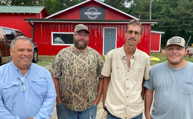 Don Uldrich (from left), Luke Barger, Todd Smith and Tracy Anderson have turned Nature’s Harvest Meat Company into a full-service butcher. Uldrich and Smith are the co-owners, and Barger and Anderson are the butchers. (Dink Nesmith/The Oglethorpe Echo)