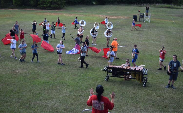 The OCHS marching band will perform a show called “Fire and Ice,” which will require drum majors on both sides of the field because it has “a lot of moving parts,” said Charlie Brewer, a drum major. (Photo/Wade Cheek)