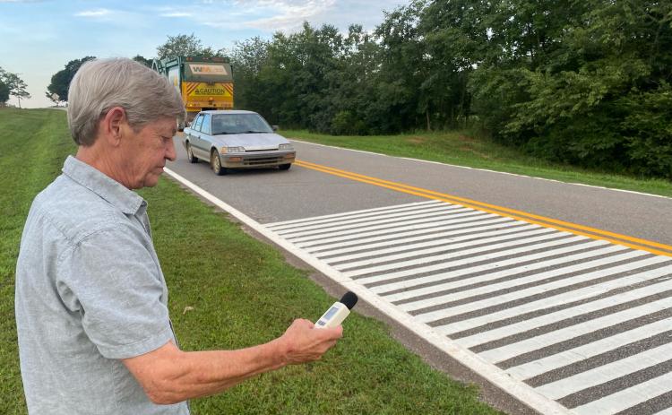 Alan Johnson, pictured, and his wife, Cindy, have lived in the Smithonia community for almost 30 years. When the new rumble strips were installed, he bought a decibel meter to measure the noise. (Photo/Dink NeSmith)