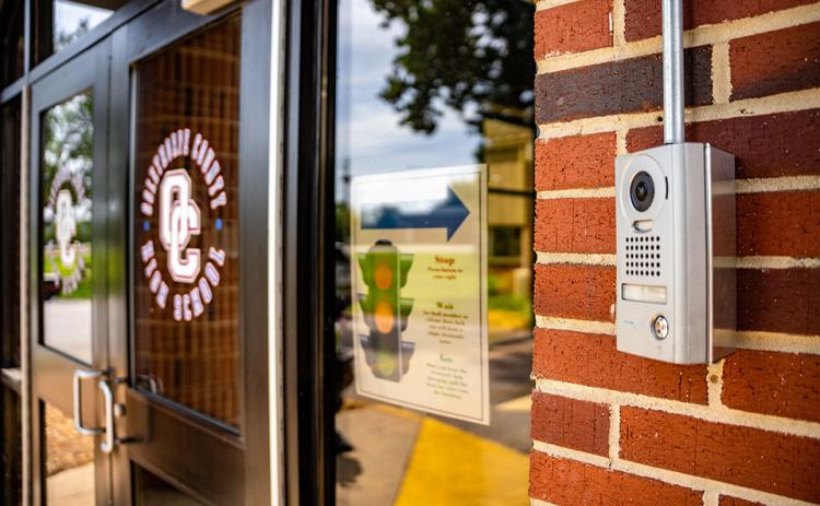 Security devices, including cameras, locks and buzzer systems, are at the doors of the county’s schools. (Photo/Jack Casey)