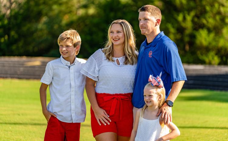 Cheerleading coach Morgan Williams with husband Cody Williams and their children Hayden and Brooklynn. (Photo/Jack Casey)