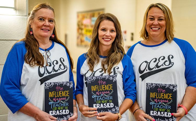 Oglethorpe County Elementary School teachers Jan Kimbrell-Lee, from left, an EIP teacher, Courtney Wheless and Katie Bailey, who both teach fifth grade, show their school pride with matching OCES T-shirts. (Photo/Jack Casey)