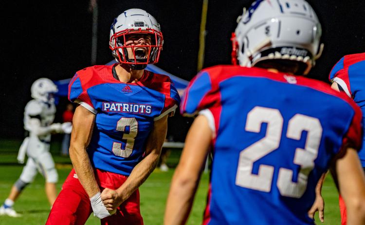 Quarterback Will Sampson lets his emotions show during an offen- sive performance in which he accounted for five touchdowns in OCHS’ 42-0 victory over Lake Oconee Academy on Friday night. (JACK CASEY/THE OGLETHORPE ECHO)