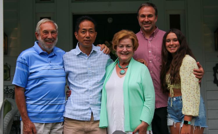 Former Oglethorpe County Japanese exchange teacher Hidekatsu Sakamoto, second from left, gathers with Warren Gilson, left, and Sherry Gilson, center, along with their son, Wesley, second from right, and granddaughter Carly before dinner on Aug. 24. (Aisha Schulz/The Oglethorpe Echo)