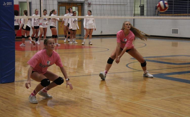 Weslynn Thurmond (left) and Madi Kelley warm up before their game against Lake Oconee Academy on September 15. (Photo/De Turner)