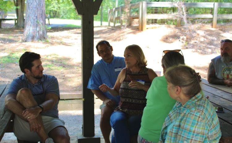 Family members reminisce and tell tales of how they found their connection within the Booth-Moore family tree. The family has had a reunion for 44 consecutive years. (Lily Baldwin/ The Oglethorpe Echo)