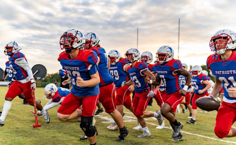 Members of the Oglethorpe County football team sprint onto the field prior to their game against Seckinger on Sept. 29. The Patriots defeated the Jaguars 35-0 to improve to 5-1 this season. (Jack Casey/The Oglethorpe Echo)