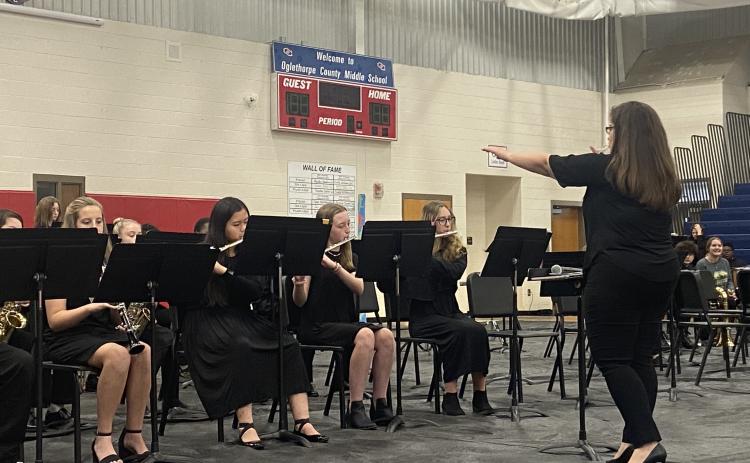 OCMS band director Erin Serrian leads the jazz ensemble through a portion of its concert on Tuesday. The sixth-grade band and a combined band of seventh- and eighth-graders also performed. (Photo/Emily Rose Hamby)