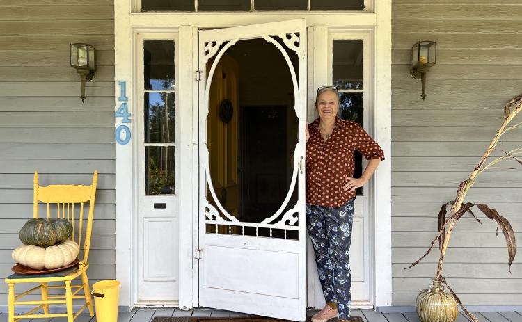 Well-known artist Rebecca Wood stands at the door of her Lexington home, one of many downtown Lexington locations on the Art Crawl on Saturday. (Megan Fitzgerald/The Oglethorpe Echo)