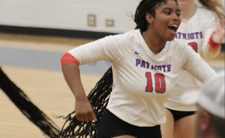 Oglethorpe County’s Tania Latimore is fired up in the third set of the area title match last Thursday. The Patriots captured their first area title with a 3-0 win over Aquinas. (Photo/Maggie Ruland)