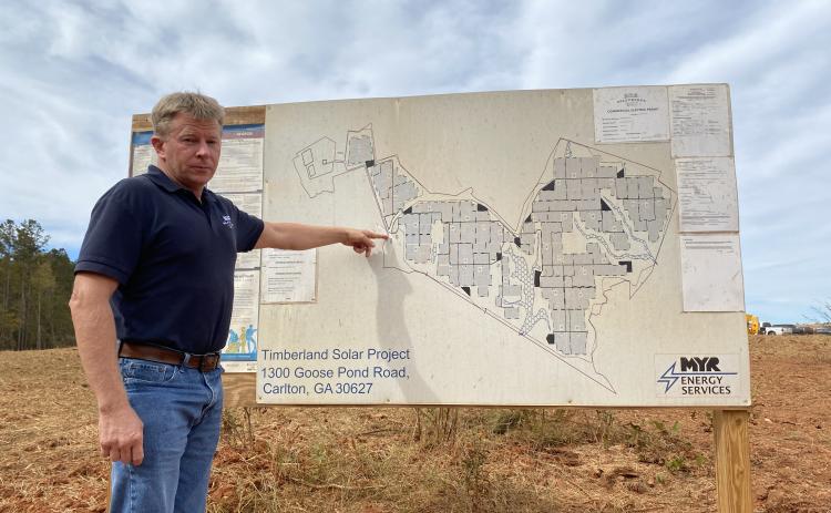 Chairman of the Board of Commissioners Jay Paul shows a map of the Timberland Solar Project, to which he is opposed.