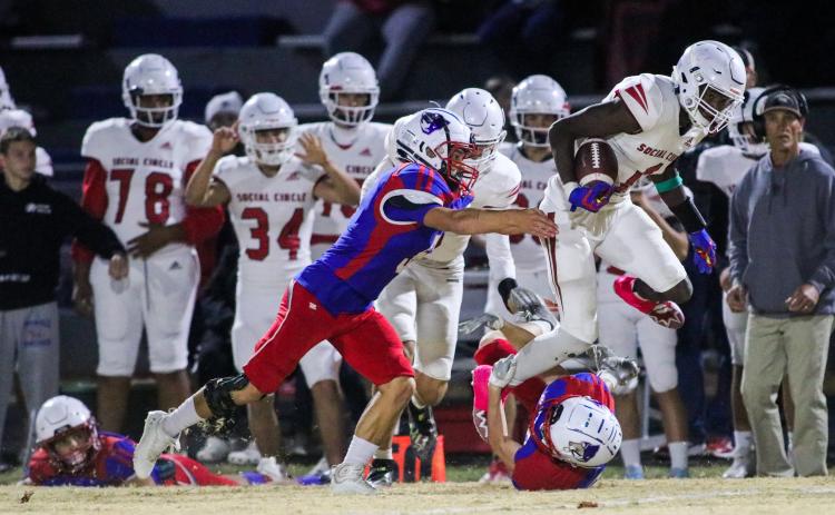 OCHS offensive linebacker Landon Faust and wide receiver Brady Allgood bring down Social Circle strong safety Phillip Baynes Jr. OCHS homecoming game, Friday, Oct. 28, 2022. (Aisha Schulz/The Oglethorpe Echo)