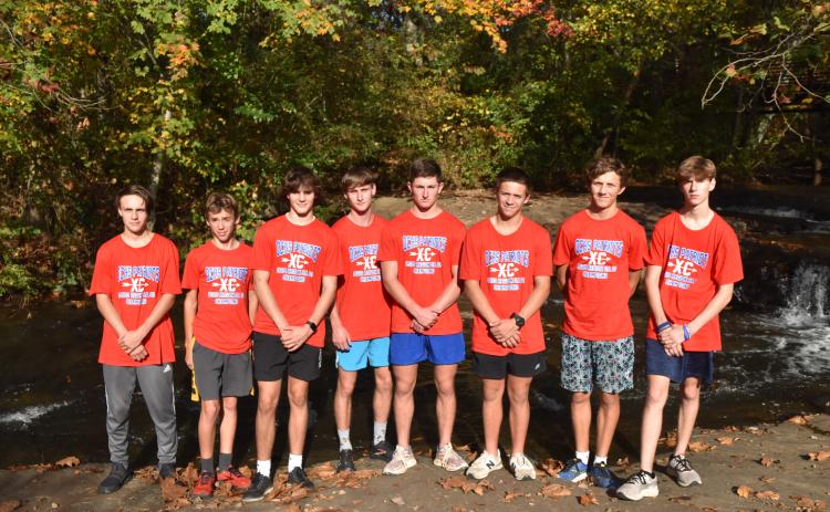 The OCHS boys cross country team at the Carrollton Greenbelt trail on Thursday before the state championship.