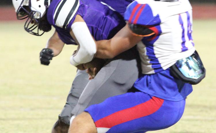 Ashton Sexton brings down a Jasper County ball carrier in the regular-season finale last Friday night. (DONNY FAUST/FOR THE OGLETHORPE ECHO)