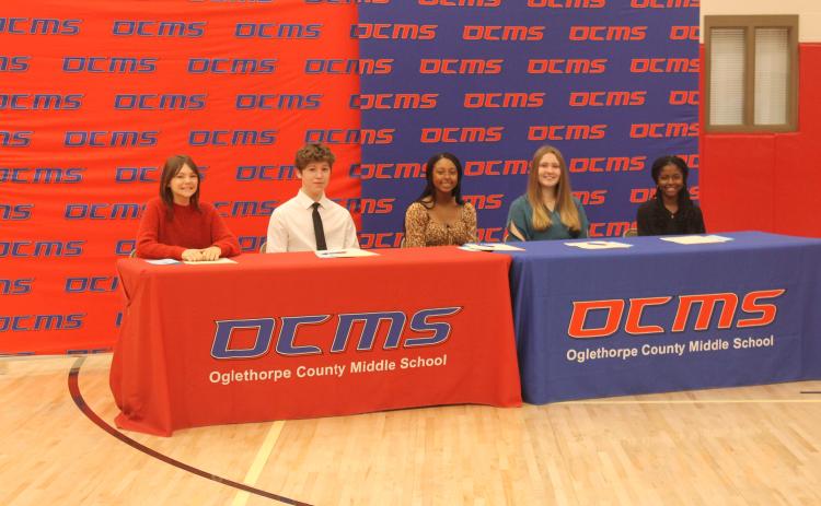 Oglethorpe County Middle School’s five REACH Scholars wait for the signing ceremony to begin. The five students are (from left): Emma Baker, Christian Harris, Mya Jewell, Melody Roberts and Shyanne Spade. They will receive $10,000 in scholarship funds and mentoring resources if they maintain good grades, attendance and behavior throughout high school. (Submitted Photo)