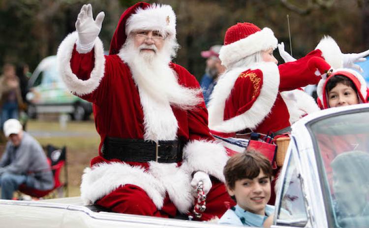 Santa waves from his float in last year’s Maxey's Christmas Parade. This year’s parade, which is scheduled for 11 a.m. Saturday, will feature live music. (Staff/File)