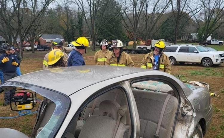 Firefighters learned how to remove the doors and windshield off of a car using hydraulic cutting tools. (Photo Courtesy/Jennifer King)