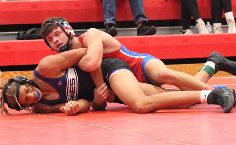 LT Faust grabs the advantage over a competitor at the North Oconee Duals this past weekend. Faust has returned from an ACL injury for his senior season. (DONNY FAUST/FOR THE OGLETHORPE ECHO)