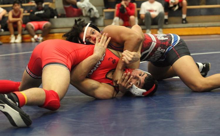 Jayce Brown gains the upper hand on his opponent in the 157-pound weight class during the Oconee County Round Robin tournament on Nov. 19. (Donny Faust/For The Oglethorpe Echo)