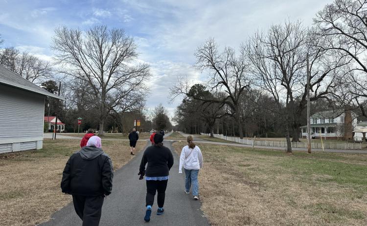 Ten Oglethorpe County residents walk for 45 minutes along the Firefly Trail during the Walk-A-Weigh session on Jan. 21, 2023 at 9 a.m.. This portion of the trail is located right outside the program's meeting spot at Maxeys Volunteer Fire Department, 369 S Main St, Stephens, GA 30667. (Photo/Gianna Rodriguez)