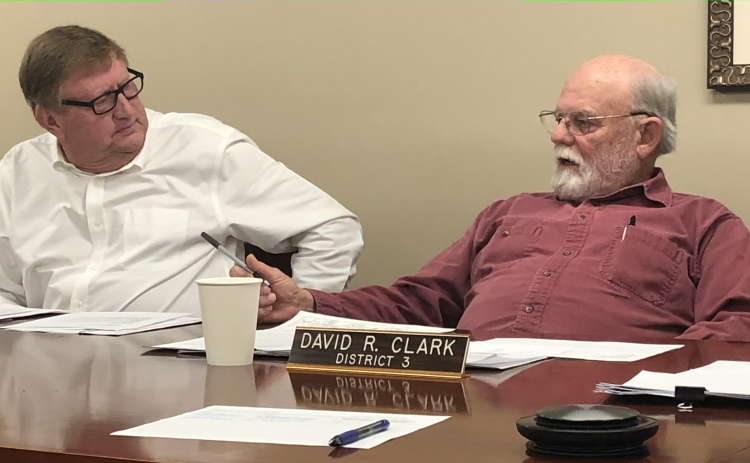 (ANDY JOHNSTON/THE OGLETHORPE ECHO) Commissioners Andy Saxon and David Clark discuss issues during the Board of Commissioners meeting on Monday night. The board passed a resolution stating the county's position on soil amendments.