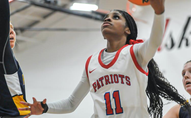 Denim Goddard shoots for two of her 15 points to lead Oglethorpe County to a 52-39 win over Prince Avenue in the Region 5-A Division I championship game. Goddard was selected as the region player of the year. (CHARLES JORDAN/THE OGLETHORPE ECHO)